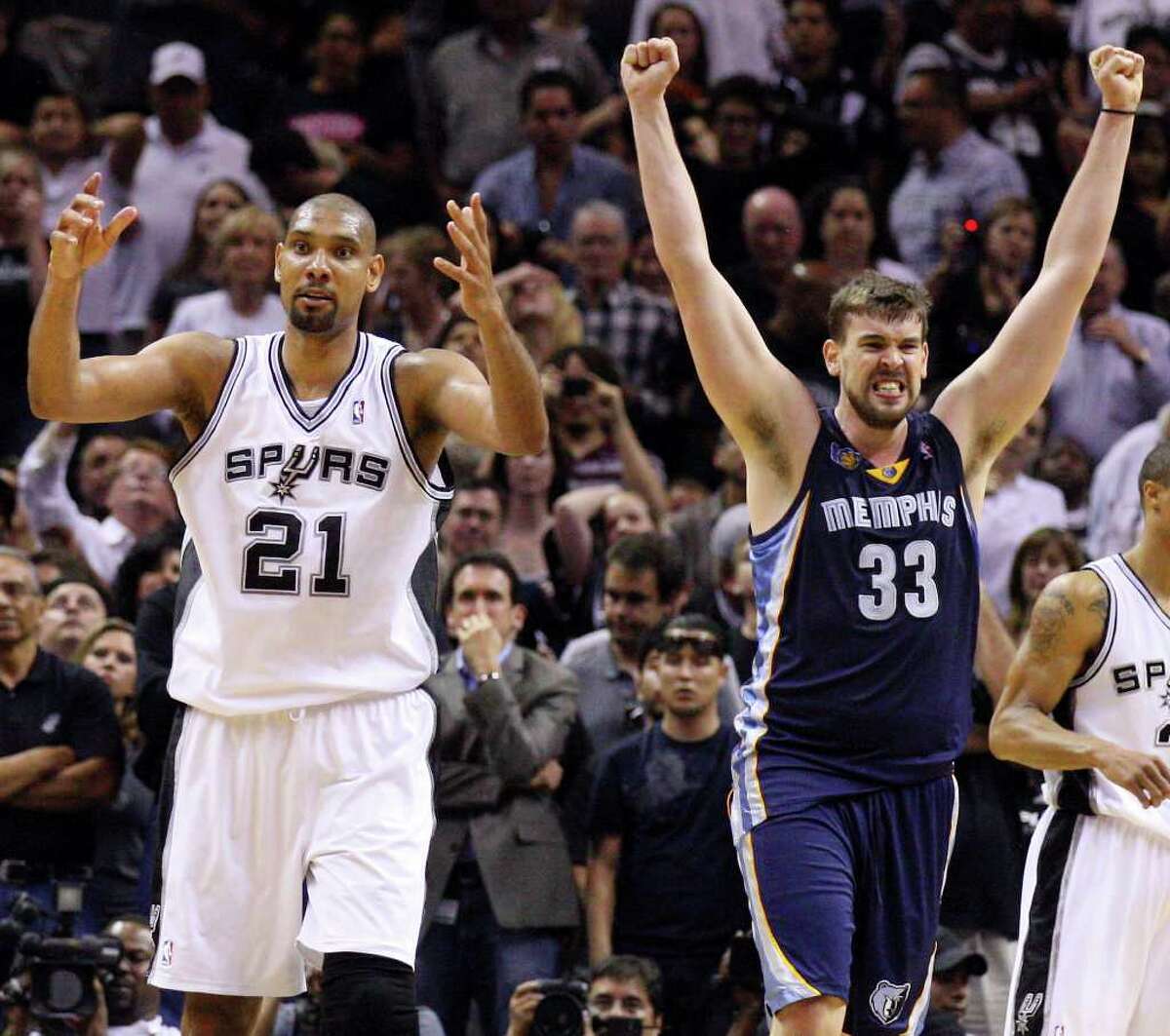 FOR SPORTS - San Antonio Spurs' Tim Duncan (left) reacts at the end of the game as Memphis Grizzlies' Marc Gasol celebrates in game one of the NBA Western Conference First Round at the AT&T Center Sunday April 17, 2011. The Grizzlies won 101-98. (PHOTO BY EDWARD A. ORNELAS/eaornelas@express-news.net)