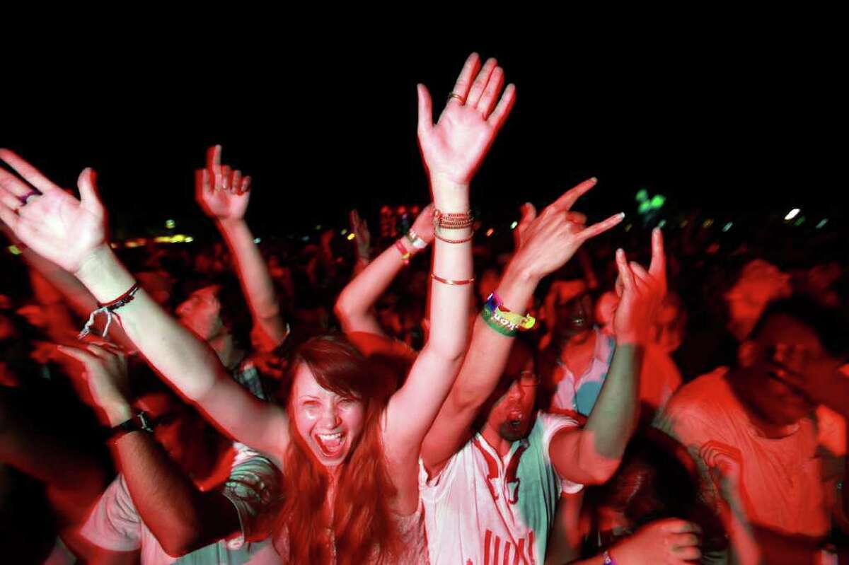Fans cheer at the outdoor stage during The Kills performance at Coachella Valley Music and Arts Festival, Saturday, April 16 2011, in Indio, Calif.