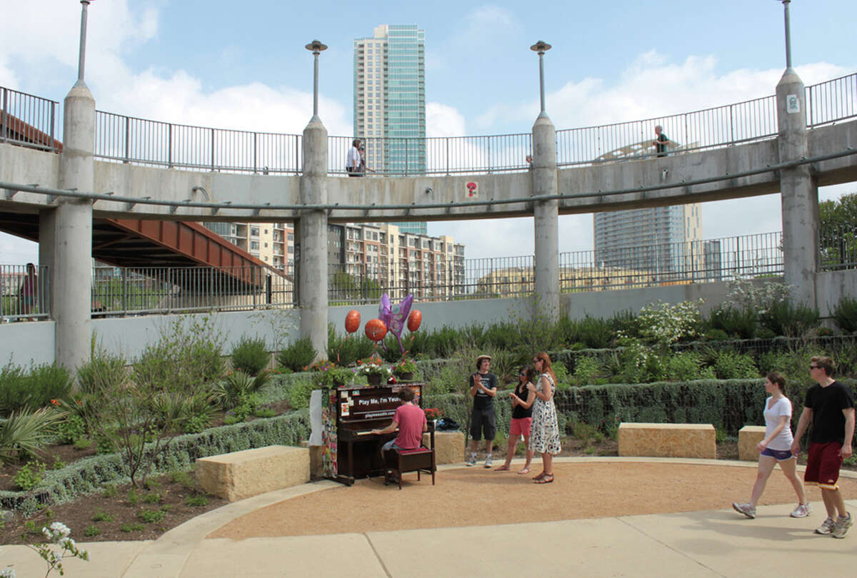 A piano on the pedestrian bridge over Lady Bird Lake inspires impromptu concerts. KATHLEEN SCOTT / SPECIAL TO THE EXPRESS-NEWS