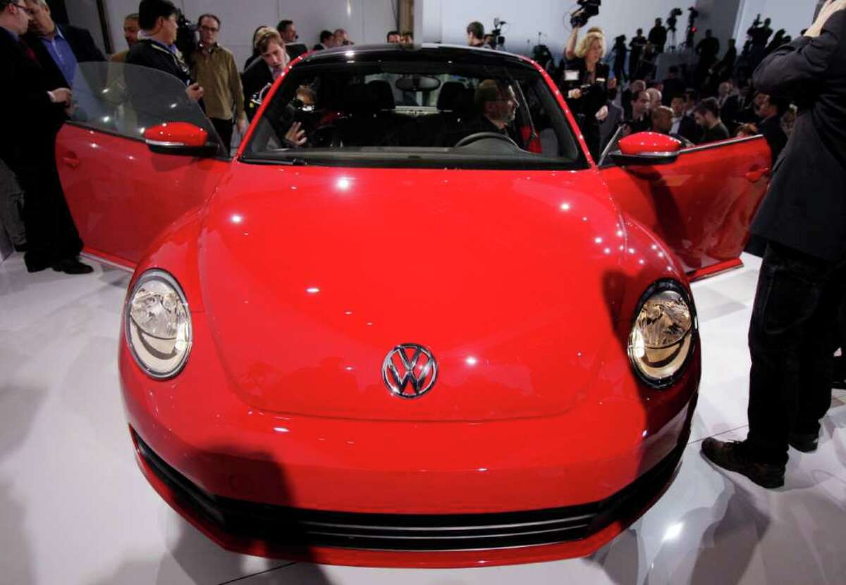 The 2012 Volkswagen Beetle is introduced, in New York, Monday, April 18, 2011. In its 73-year history, the Beetle has evolved from the hippie ride of choice to a cute chick car. Now Volkswagen is reinventing it again.