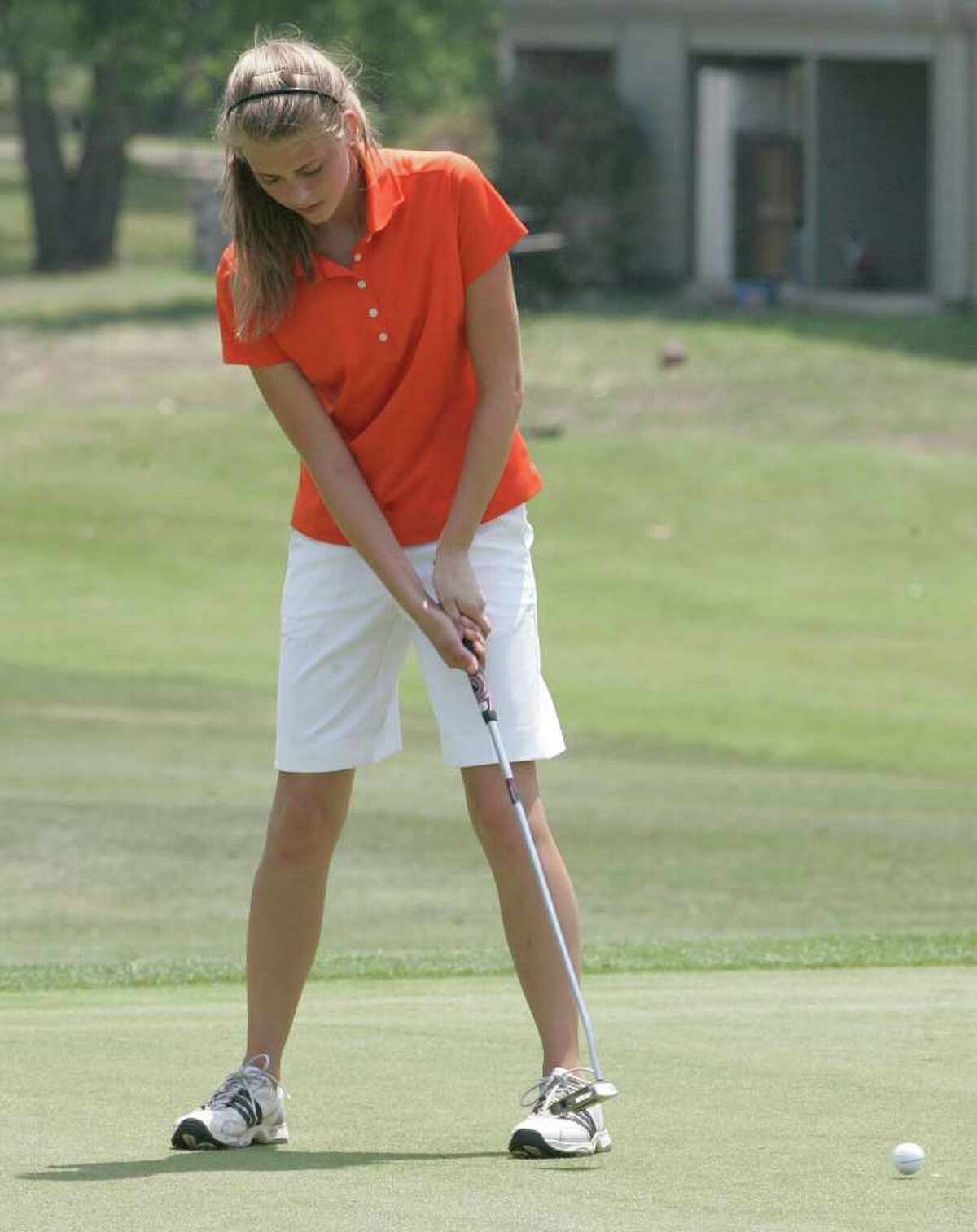 Medina Valley's Caitlyn Keller putts on the ninth hole Monday, April 18, 2011, in the first round of the Region IV-4A girls' golf tournament at Pecan Valley Golf Course.