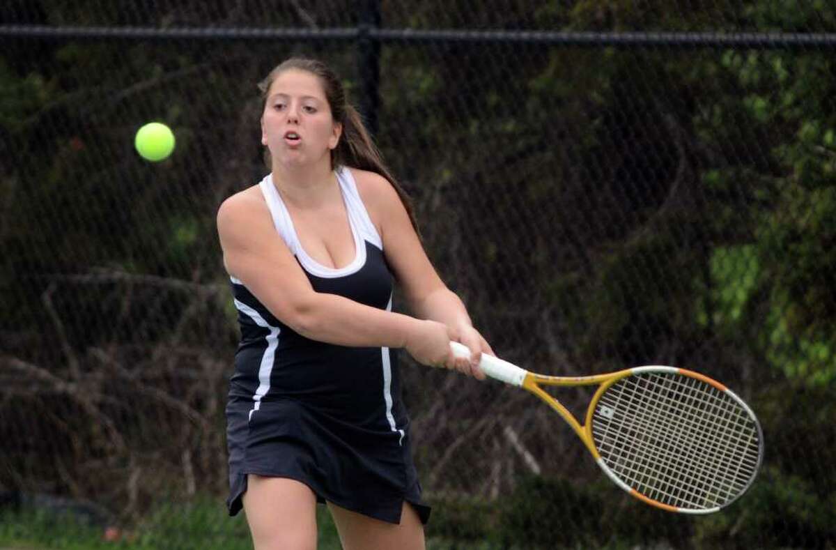 Fairfield Warde's Haley Wolf, no. 2 singles, returns the serve during the girls tennis match against Staples at Warde on Monday, Apr. 18, 2011.