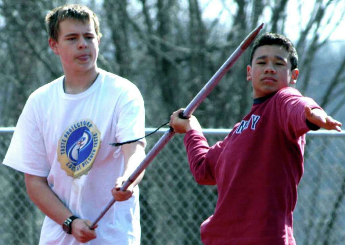 SPECTRUM/Dakota Wilson, left, and David Geyer work together on improving their javelin technique for Shepaug Valley High School boys' track. April 8, 2011