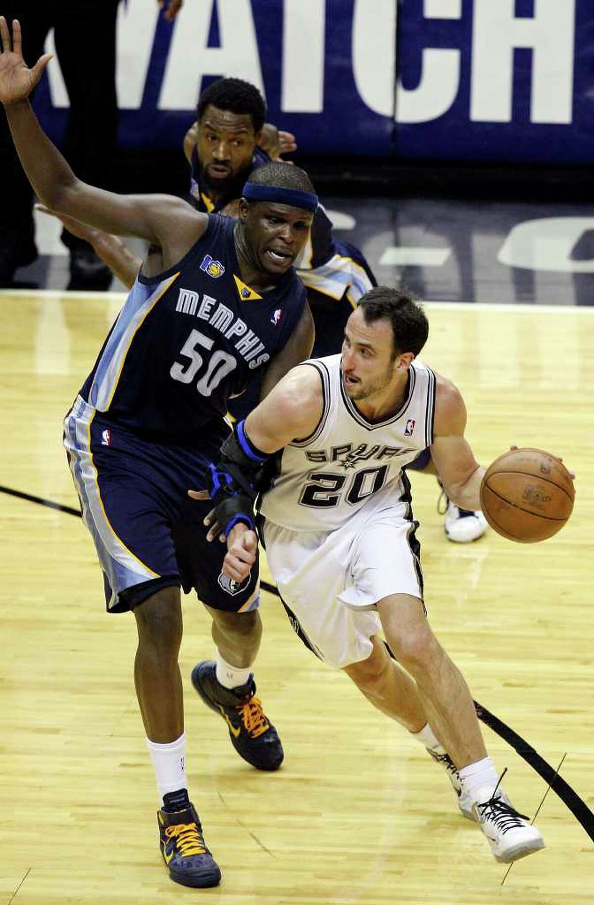 FOR SPORTS - San Antonio Spurs' Manu Ginobili looks for room around Memphis Grizzlies' Zach Randolph during second half action of Game 2 of the first round of the Western Conference playoffs at the AT&T Center Wednesday April 20, 2011. The Spurs won 93-87.(PHOTO BY EDWARD A. ORNELAS/eaornelas@express-news.net)