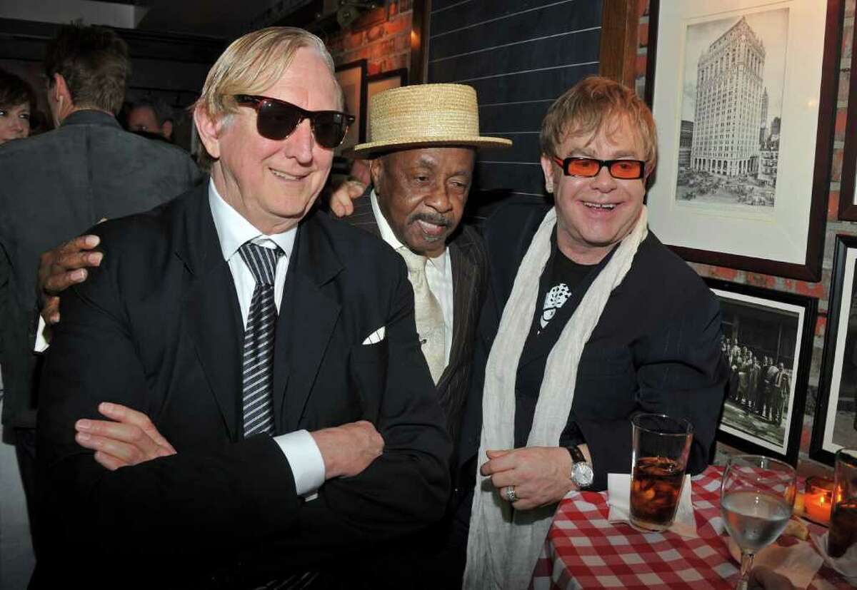 NEW YORK, NY - APRIL 20: (L-R) Producer T-Bone Burnett,The Mighty Hannibal and Sir Elton John attend the opening night premiere of "The Union" at the 2011 Tribeca Film Festival at North Cove at World Financial Center Plaza on April 20, 2011 in New York City. (Photo by Stephen Lovekin/Getty Images) *** Local Caption *** T-Bone Burnett;The Mighty Hannibal;Sir Elton John;
