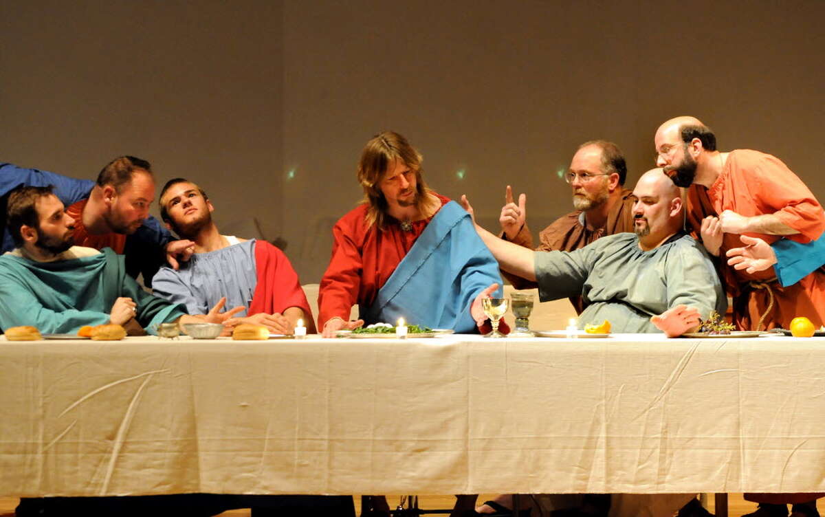 Jesus Christ, played by Robert Dahoda, center, and his 12 disciples pose to resemble Leonardo Da Vinci?s painting of the Last Supper during Maundy Thursday service at Shenendehowa United Methodist Church in Clifton Park. (Cindy Schultz / Times Union)