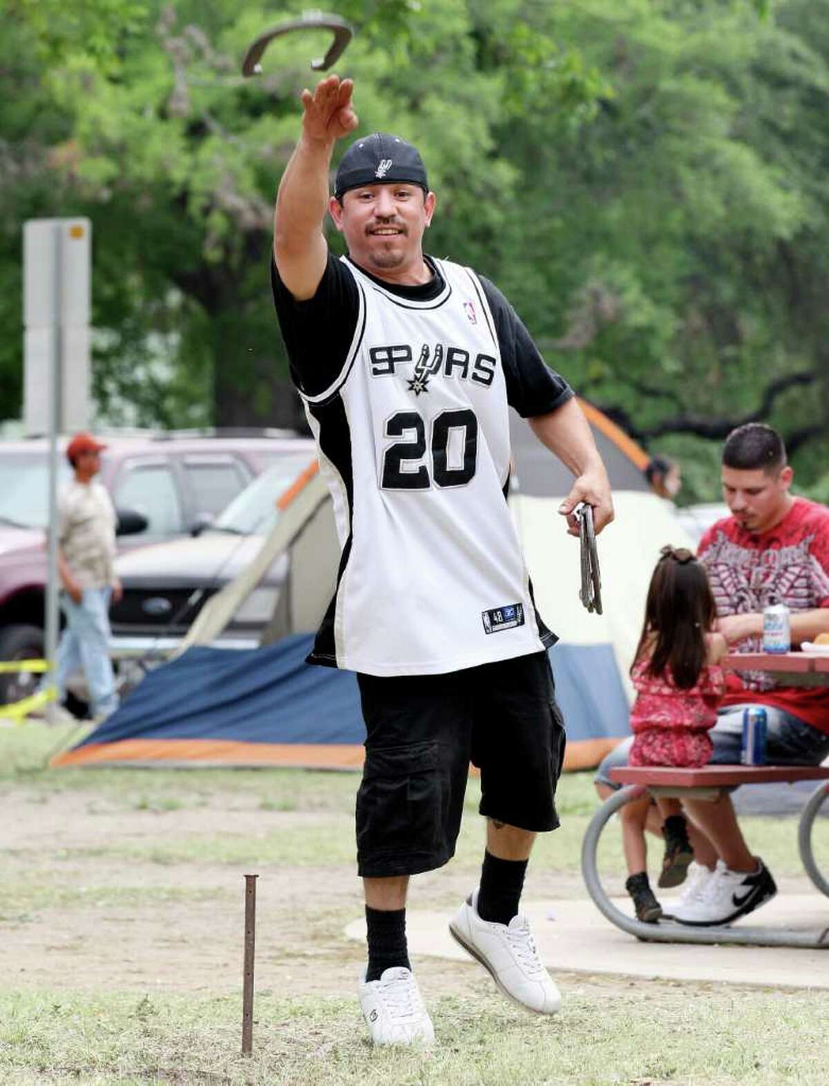 Nathan Ortiz plays horseshoes Sunday April 24, 2011 at Brackenridge Park while spending Easter with his family. (PHOTO BY EDWARD A. ORNELAS/eaornelas@express-news.net)