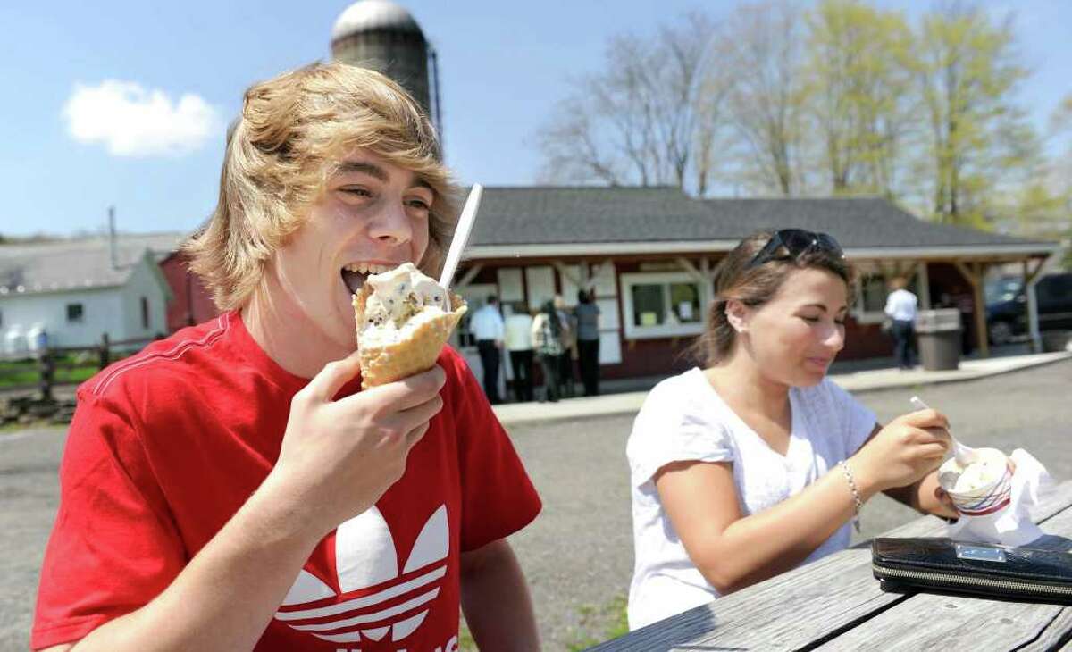 Josh Rose, of Bethel, left and Jenna Kaufman, 17, of Bethel, enjoy ice cream at Ferris Acres Creamery in Newtown Tuesday, April 27, 2011.