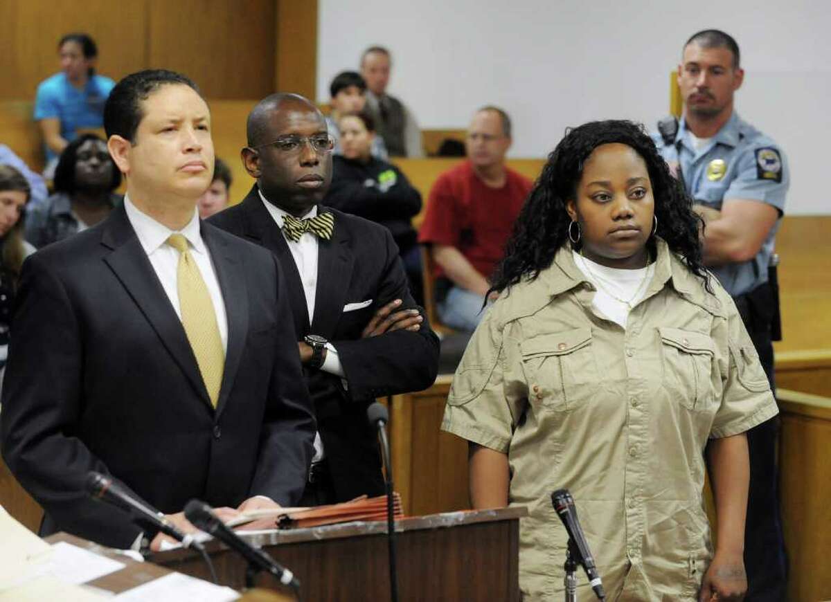 Tanya McDowell is arraigned in Norwalk Superior Court on larceny charges in Norwalk, Conn. on Wednesday April 27, 2011. McDowell's attorney's Michael Thomas and Darnell Crosland stand with her. McDowell allegedly used a false Norwalk address to enroll her son in Brookside Elementary School.