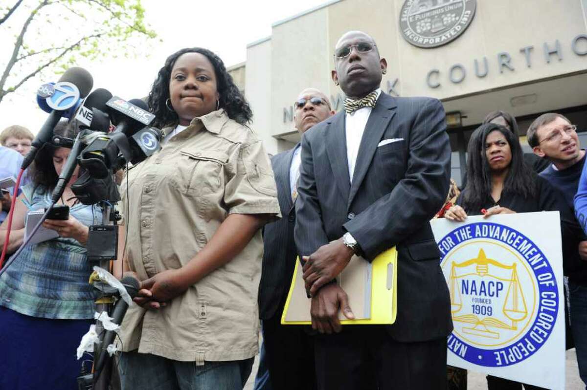 Tanya McDowell conducts a press conference before her arraignment at Norwalk Superior Court on larceny charges in Norwalk, Conn. on Wednesday April 27, 2011. She is accompanied by her attorney Darnell Crosland. McDowell allegedly used a false Norwalk address to enroll her son in Brookside Elementary School.