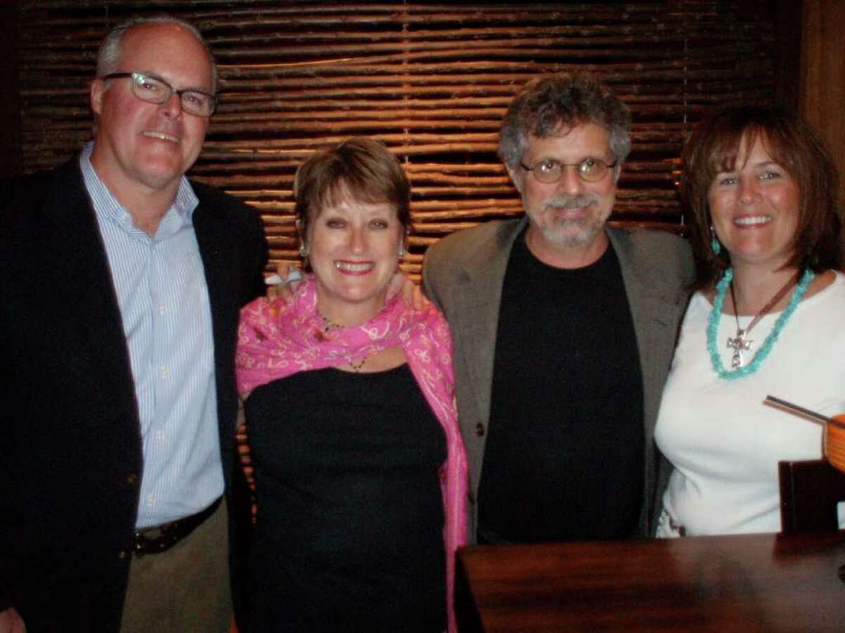Dennis Quinn (from left) and his wife, Joan Cheever, have "Planet Barbecue!" author Steven Raichlen autograph their books, along with Pam Stevenson at the San Antonio Library Foundation dinner at Q restaurant.