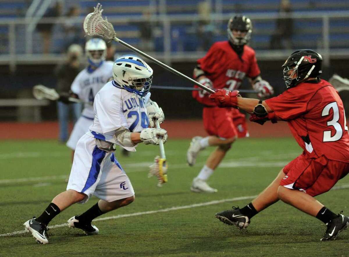 Ludlowe's George Voucas takes a shot during Wednesday's lacrosse game against New Canaan at Fairfield Ludlowe High School on April 27, 2011.