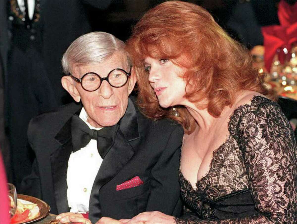 US entertainer George Burns (L) talks with actress Ann Margret during the Inaugural Screen Actors Guild Awards Show 25 February in Los Angeles. Margaret later presented Burns with a lifetime achievement award for his many years as a screen performer. (COLOR KEY: Burns has red hankerchief in pocket) AFP PHOTO