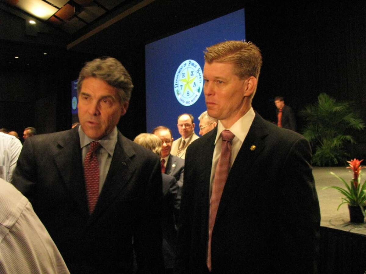 Gov. Rick Perry (left) and emergency management official Nim Kidd answer questions after the conference’s general session.