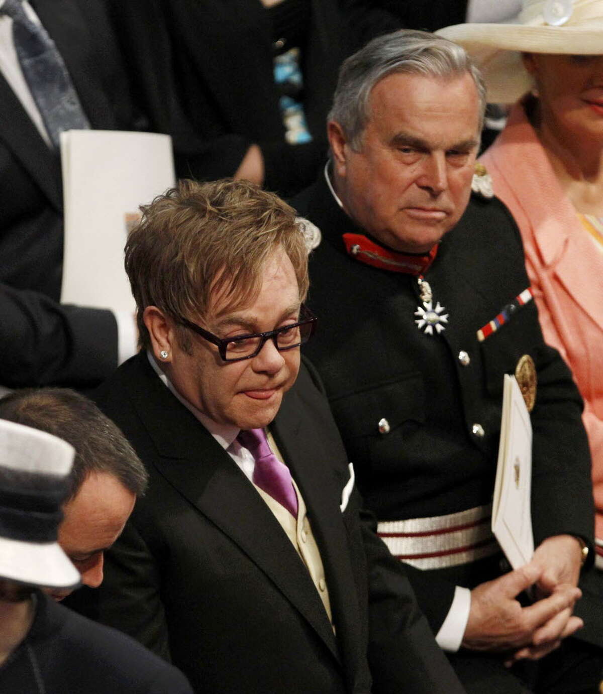LONDON, ENGLAND - APRIL 29: Sir Elton John arrives at Westminster Abbey ahead of the Royal Wedding of Prince William to Catherine Middleton at Westminster Abbey on April 29, 2011 in London, England. The marriage of the second in line to the British throne is to be led by the Archbishop of Canterbury and will be attended by 1900 guests, including foreign Royal family members and heads of state. Thousands of well-wishers from around the world have also flocked to London to witness the spectacle and pageantry of the Royal Wedding. (Photo by Suzanne Plunkett - WPA Pool/Getty Images)