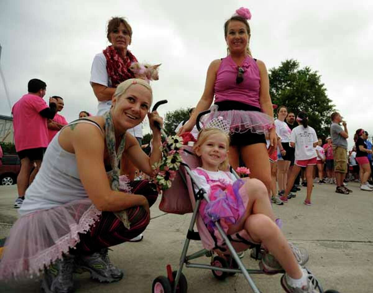Clockwise from left, Bobbi Bryant and her mother, Barbara Bryant , accompany her sister, Julie Fenton and her daughter Cloe, 5, as they prepare for the Susan G. Komen Race for the Cure on Saturday, April 30, 2011. Barbara Bryant's sister, Lynda Neveu, died of breast cancer 11 years ago. BILLY CALZADA / gcalzada@express-news.net