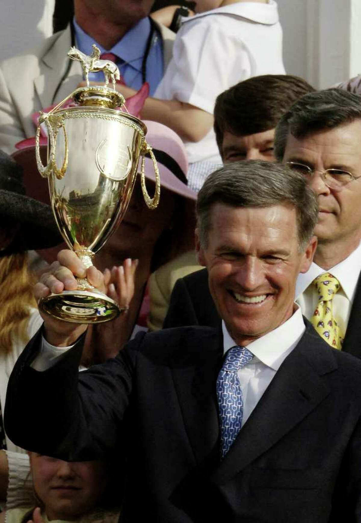 TIMES UNION STAFF PHOTO BY SKIP DICKSTEIN - Trainer Michael Matz holds the winner's trophy aloft after his trainee, Barbaro with jockey Edgar Prado won the 132nd Running of the Kentucky Derby at Churchill Downs in Louisville, Kentucky.