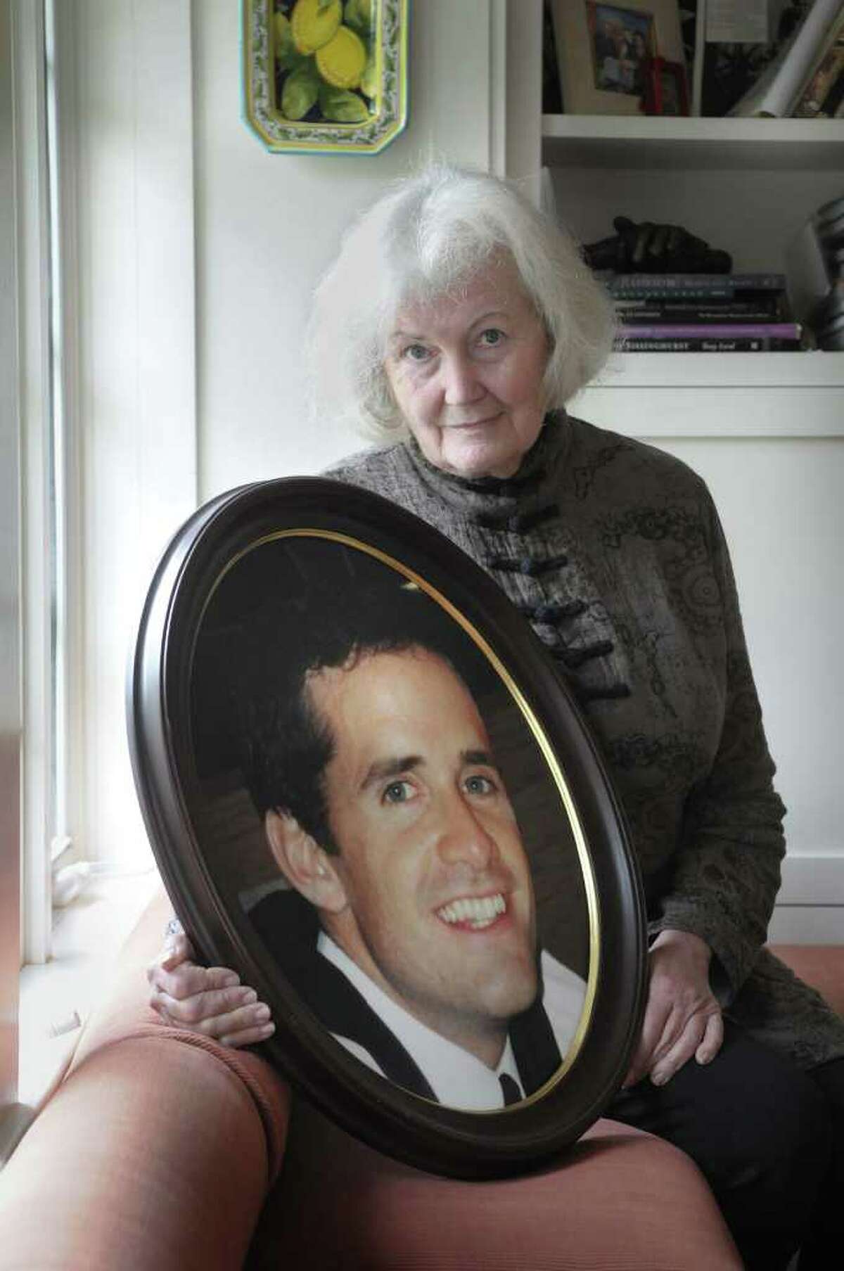 Anne Mulderry holds a portrait of her son Stephen Mulderry at her home in Kinderhook in May 2011. The framed photograph was produced for his memorial service at St. Teresa of Avila Church in Albany. Stephen had gone to school at St. Teresa of Avila school.