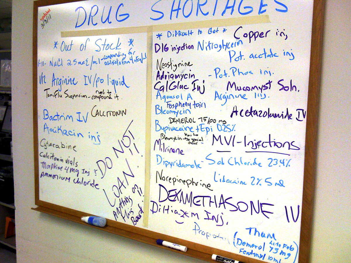 A white board outside the office of Mark A. Richerson, director of pharmacy for Christus Santa Rosa Health Care, lists prescription drugs that are in short supply. Drug shortages are becoming increasingly common nationwide.