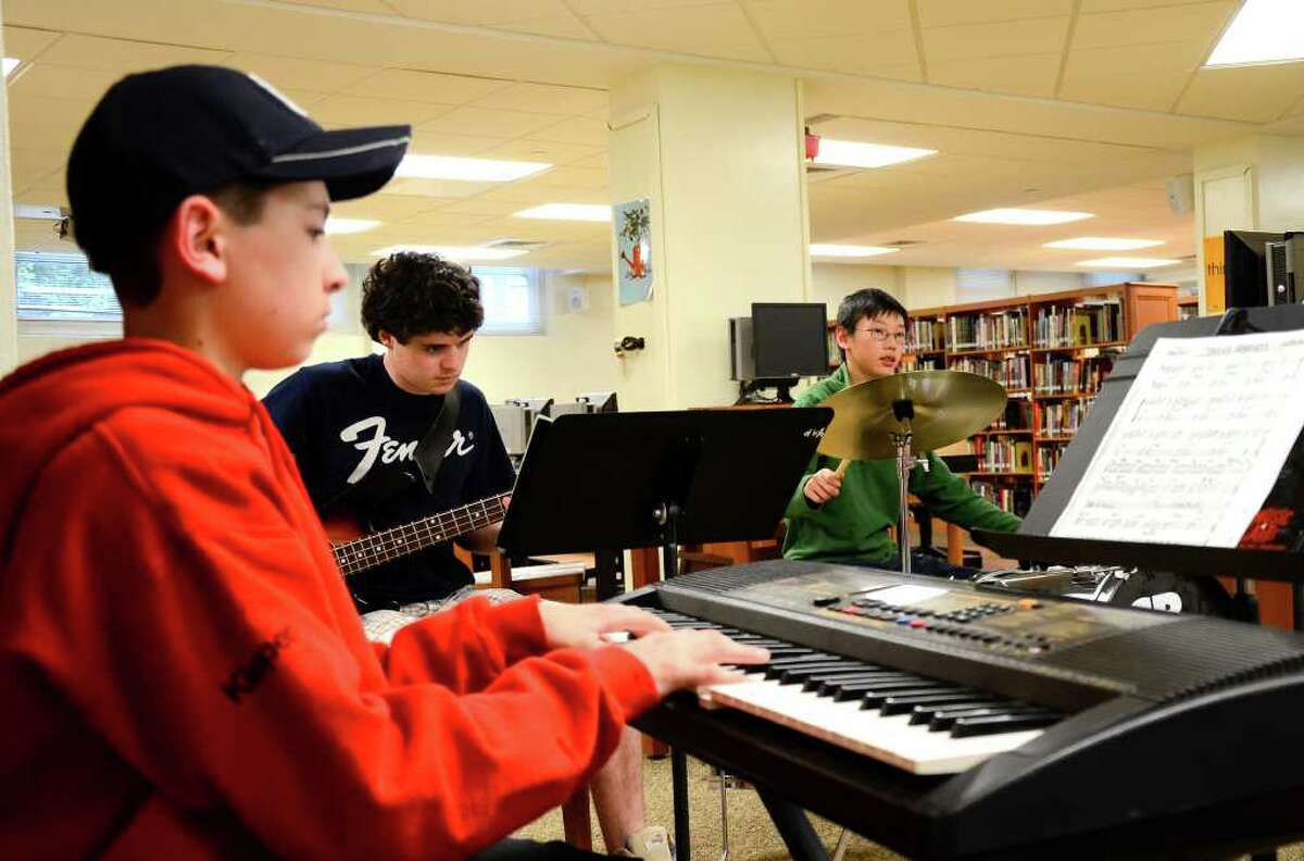 Josh Klapper (Keyboards) of New Canaan, Connor Ackley (Bass) of Darien, and Lucas Fee (Drums) from Darien, of the Young Peoples Jazz Ensemble rehearse at Stamford High School in Stamford, Conn. on May 2, 2011.