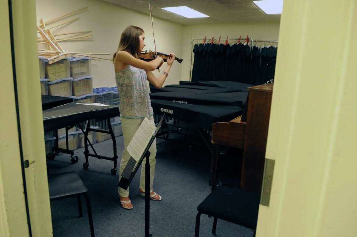 Sarah Fountain practices her violin in the practice room at Greenwich High School on Thursday, April 28, 2011.
