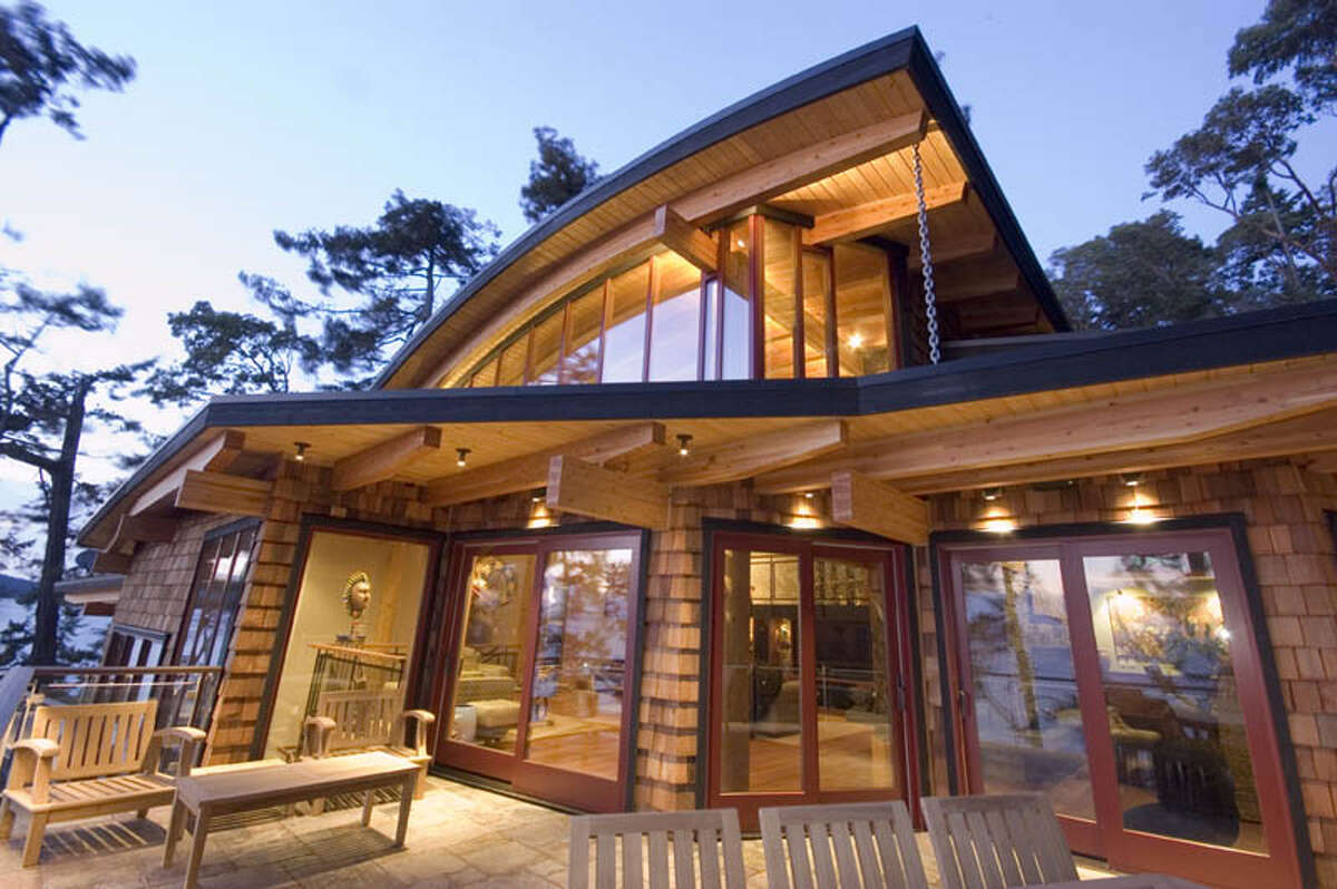 The "Natural Balance" house, in Friday Harbor, on San Juan Island, is the first house in the San Juans targeting top-level platinum certification through the U.S. Green Building Council's Leadership in Energy and Environmental Design Program, according to the project. Blue Sky Design designed the house, which Ravenhill Construction built for owners Glen and Deb Bruels. Features include a 19,500-gallon cistern that harvests rainwater as the sole water source for the home, a 3,000-square-foot green roof, at vehicle turntable to minimize the size of the driveway and garage, extensive automation for efficiency, Structural Insulated Panels, geothermal in-floor radiant heating, solar hot-water heating, a heat recovery ventilation system to supply pre-conditioned fresh air, efficient LED lighting and appliances, and extensive use of recycled and sustainable materials, including reclaimed urban wood furniture by Meyer Wells. For more information, including details on public tours, visit www.naturalbalancehouse.com.