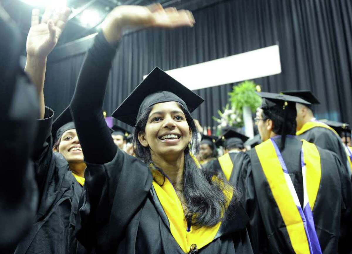 Graduate Megha Parvatikar waves to family during the University of Bridgeport's 101st commencement ceremony Saturday, May 7, 2011 at the Arena at Harbor Yard.