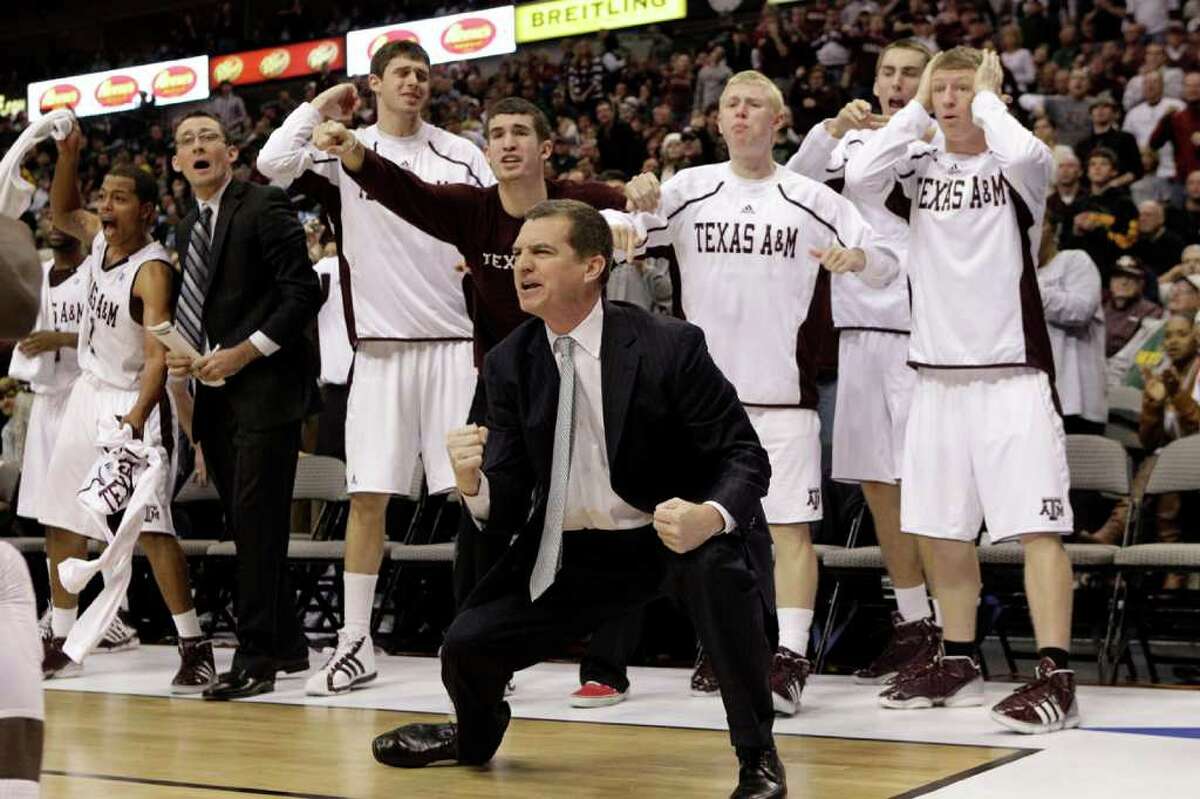 Mark Turgeon (foreground), who coached A&M into the NCAA tournament in each of his four seasons, and his players rejoice during a December game against Arkansas in Dallas.