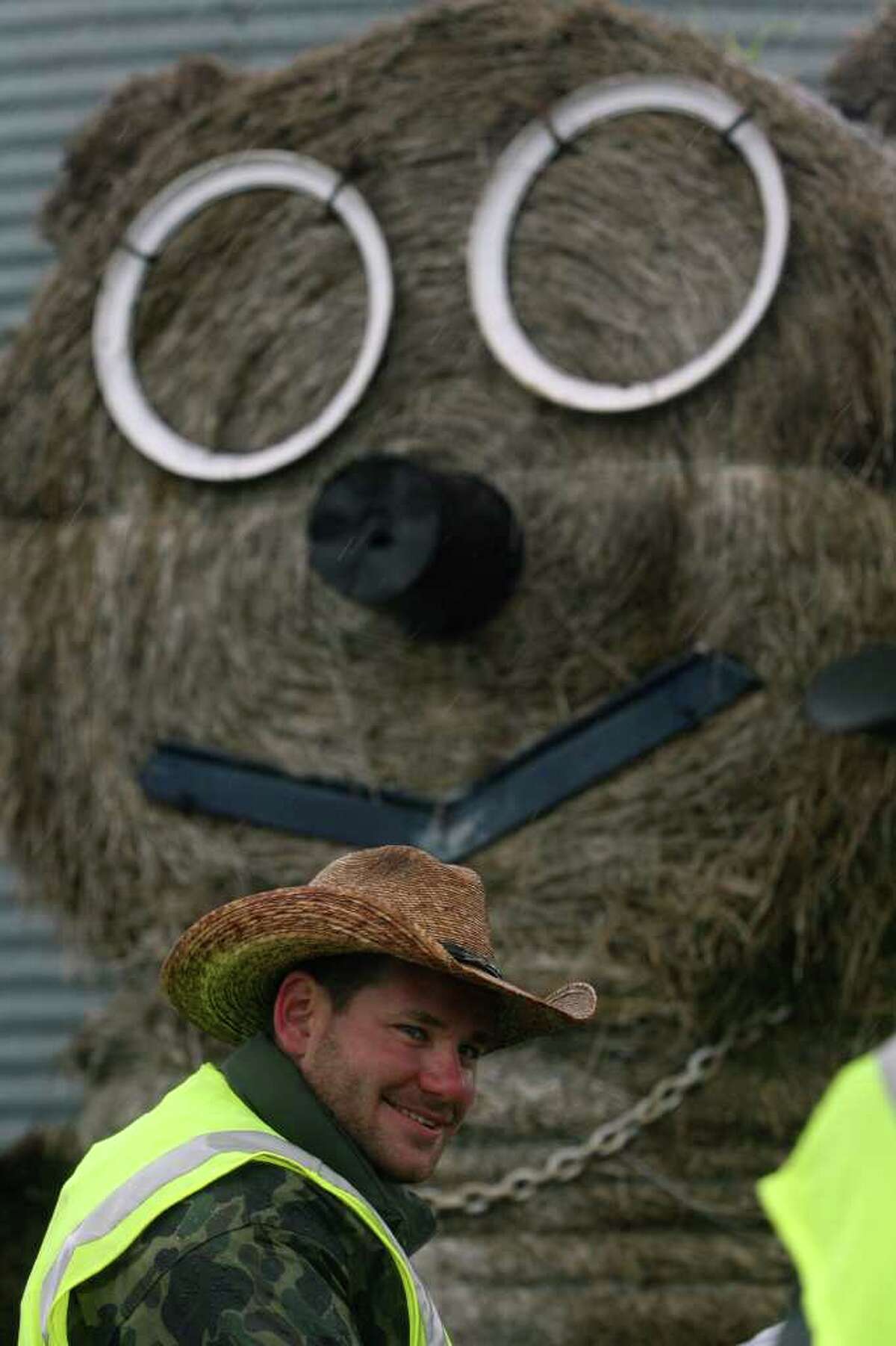 A round bale of hay with a face put on it looms over an area where the Mesquite Traildrivers stopped for a morning break while en route to San Antonio. JOHN DAVENPORT/jdavenport@express-news.net