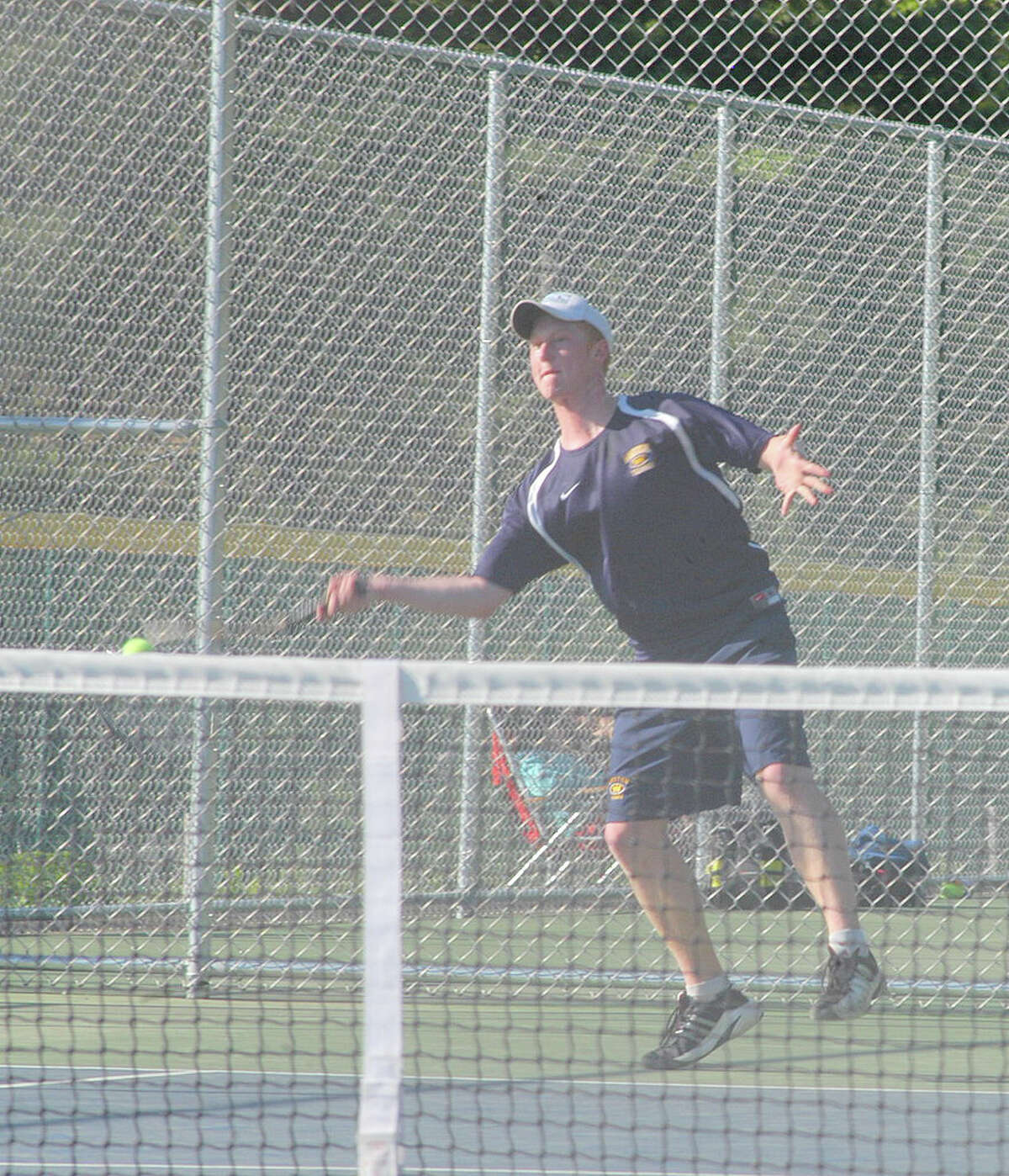 Weston junior Cameron Hagen lost 6-4, 7-6 (7-5) at first singles Monday in a 5-2 Trojan victory at Newtown.