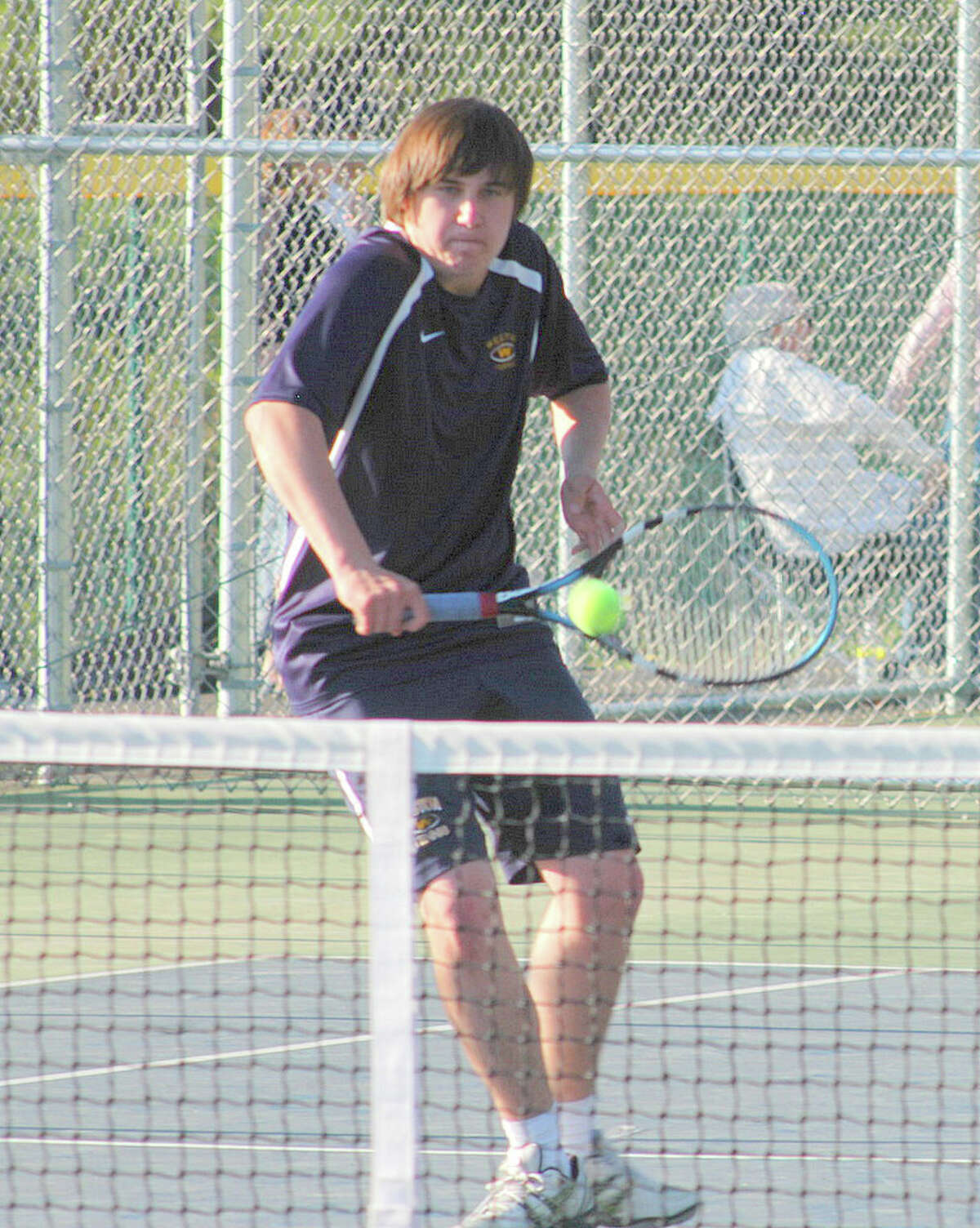 Weston sophomore Ben Lander, above, combined with freshman Henry Morris Monday in a 6-3, 6-2 victory at third doubles at Newtown. The Trojans beat Newtown, 5-2.