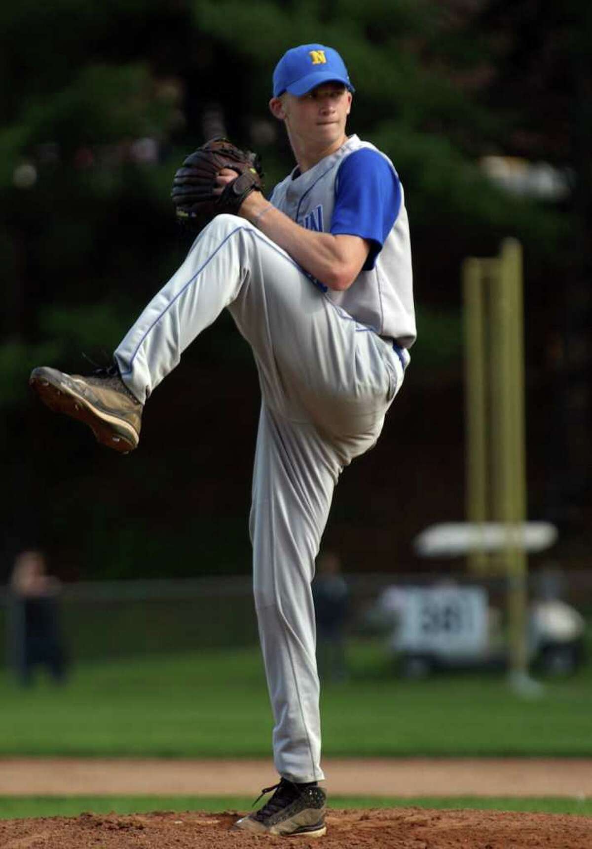 Newtown's Kyle Wilcox pitches during boys baseball action against Masuk in Monroe, Conn. on Wednesday May 11, 2011.