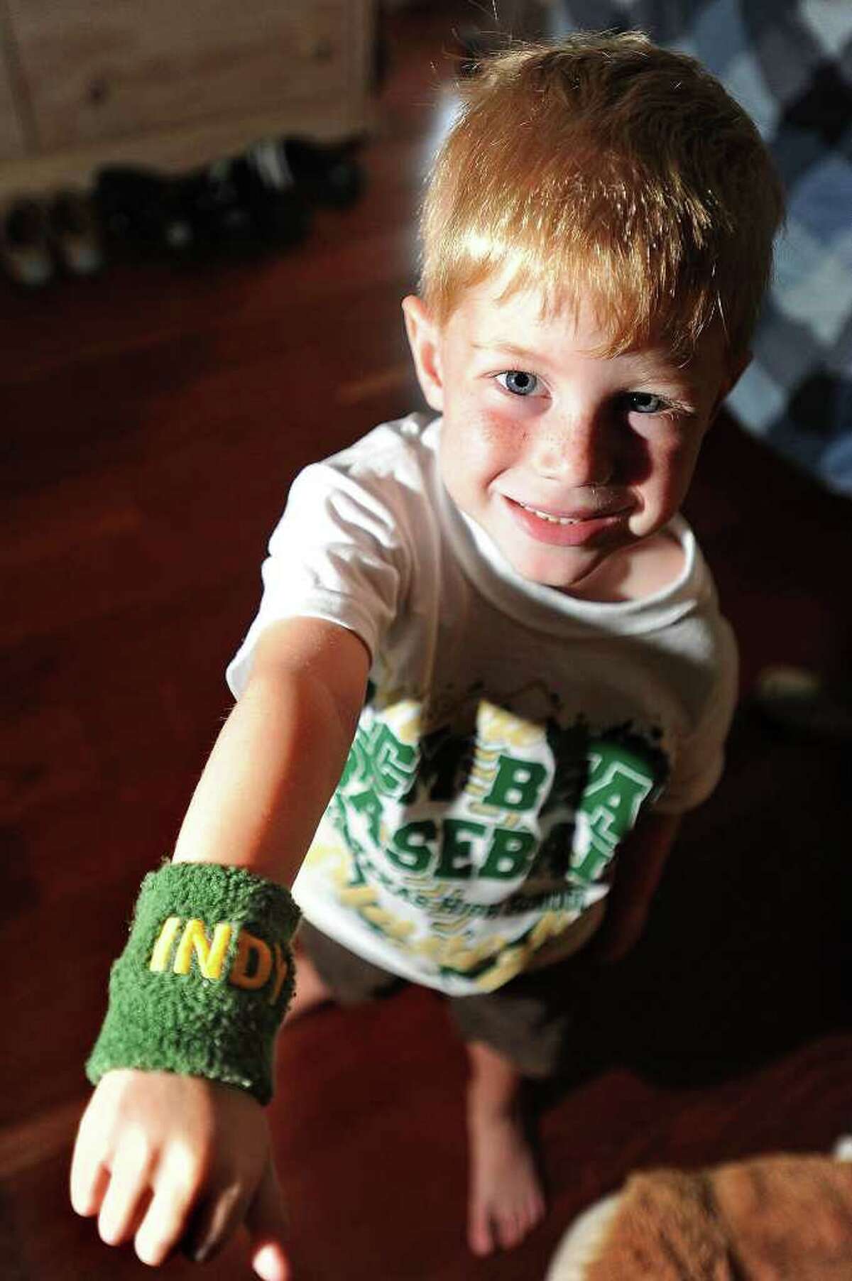 Although diagnosed with diffused infiltrated pontine glioma and told to have a diminutive life expectancy, Indy Parkhurst's spirit has earned him the title of unofficial mascot for LC-M's baseball team. In support, players have begun wearing green and gold wristbands, shown, labeled 'Indy'. Guiseppe Barranco/The Enterprise
