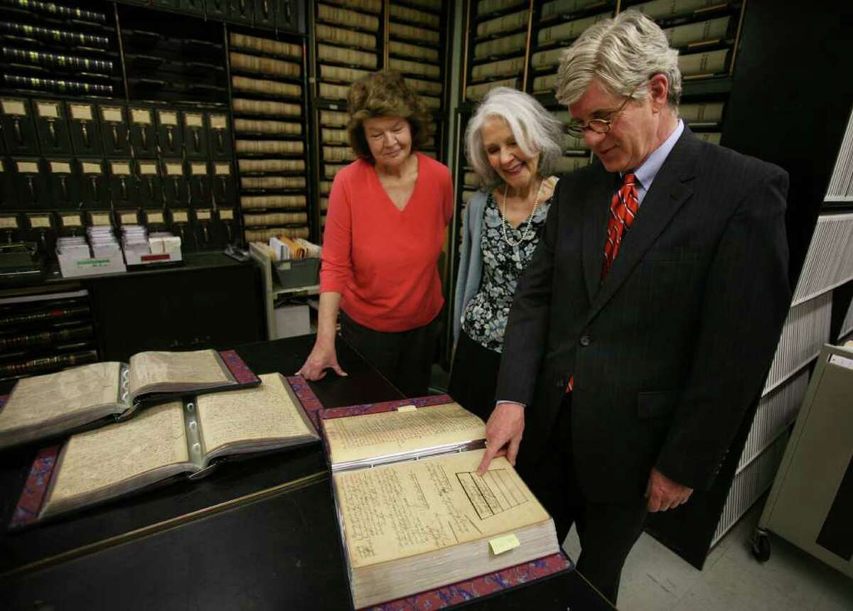 From left; Clerk Bonnie Parks, Chief Clerk Sally Mackenzie, and Judge Dan Caruso look at court records from 1766 showing the repeal of the Stamp Act, in the records room of the Fairfield Probate Court on Thursday, May 12, 2011. The Stamp Act was a form of British taxation on the colonies that was one of the ignitors of the American Revolution. The courts earliest records go back to the year 1648.