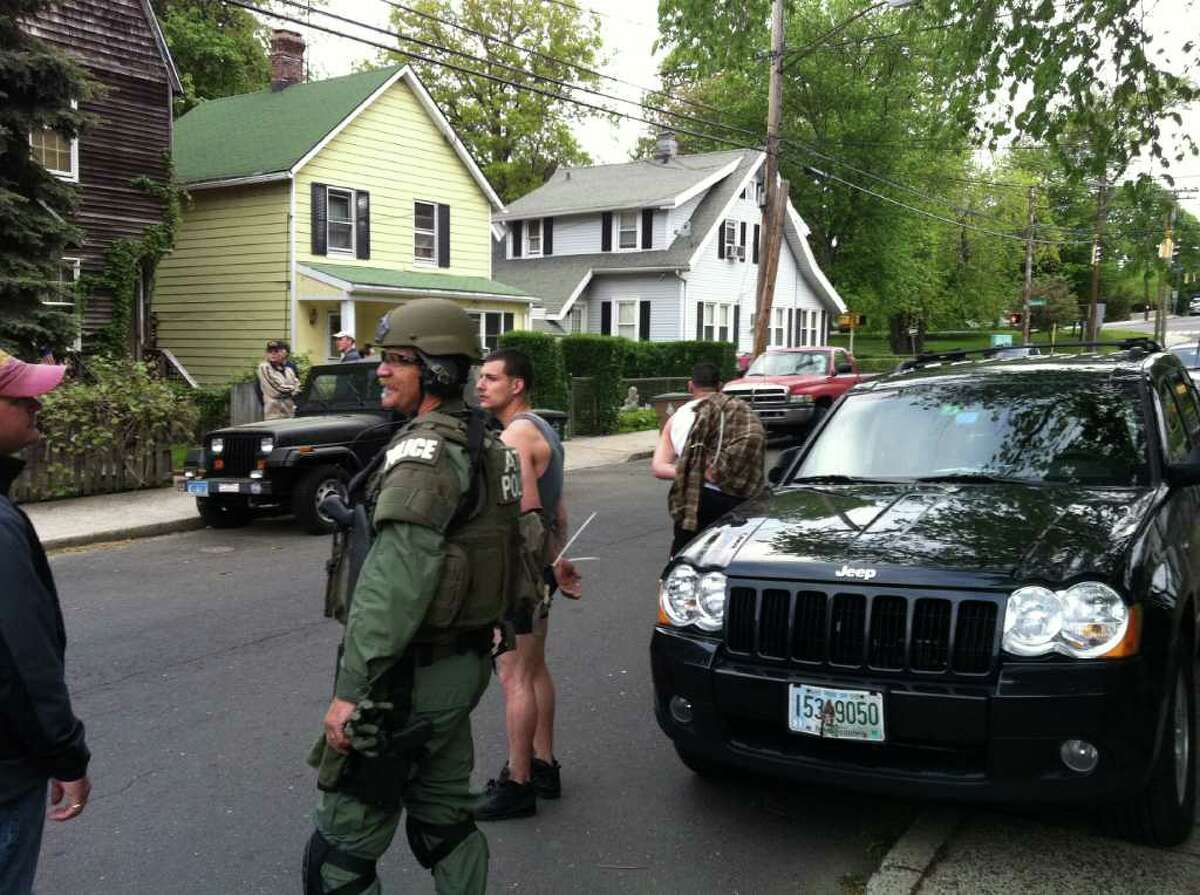 Federal agents raided a house early Thursday morning, May 12, 2011 in Stamford, Conn. and took at least two men into custody.