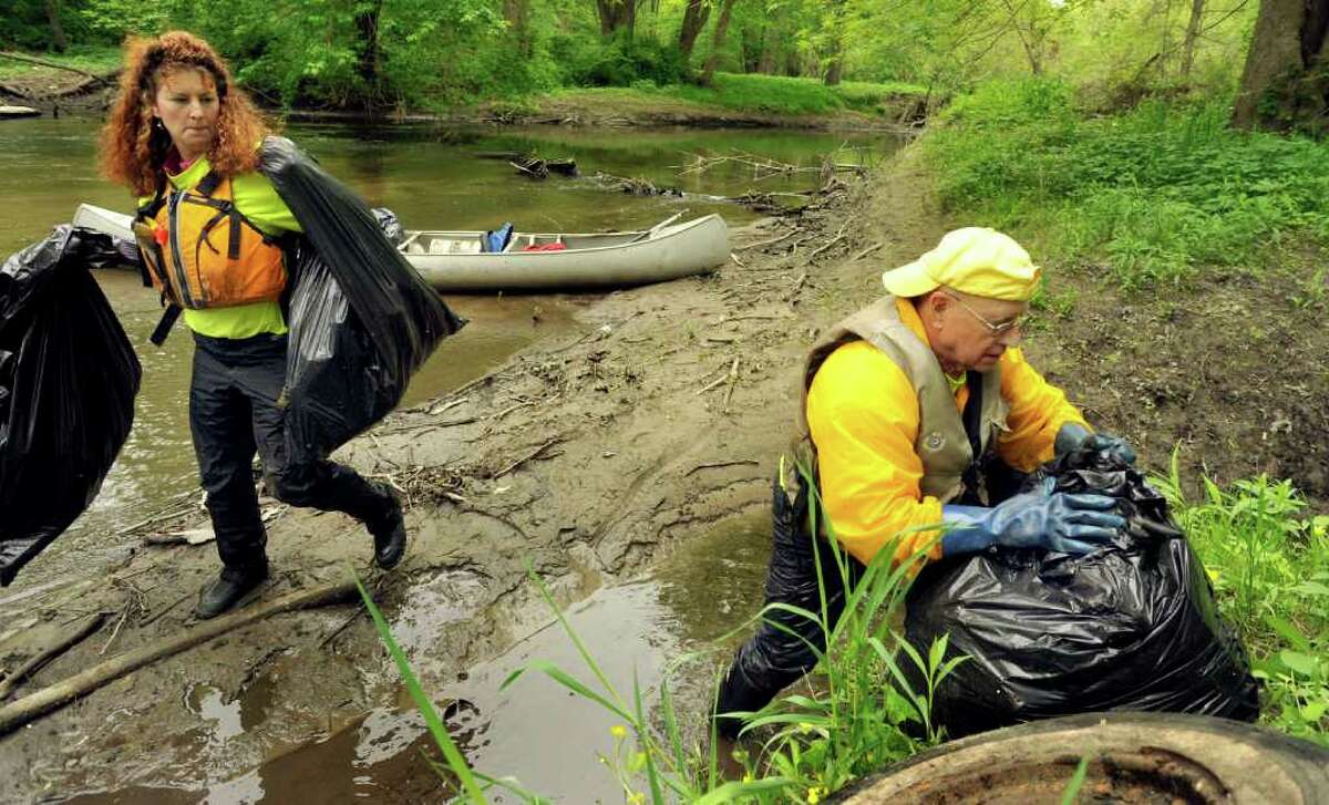Susan Tomanio, of Bethel, and Ed Foss, of Bridgewater, clean up the Still River in Brookfield during the Seventh Annual Still River Waterway and Greenway Cleanup, Saturday, May 14, 2011.