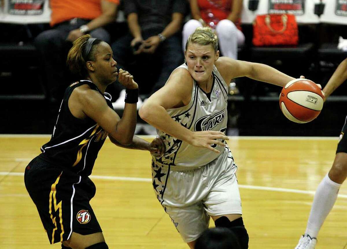 San Antonio Silver Stars center Jayne Appel, 32, drives it to the basket against Tulsa Shock forward Amber Holt, 4, on Friday, July 16, 2010 at the AT&T Center. Photo by Ivan Pierre Aguirre/iaguirre@express-news.net