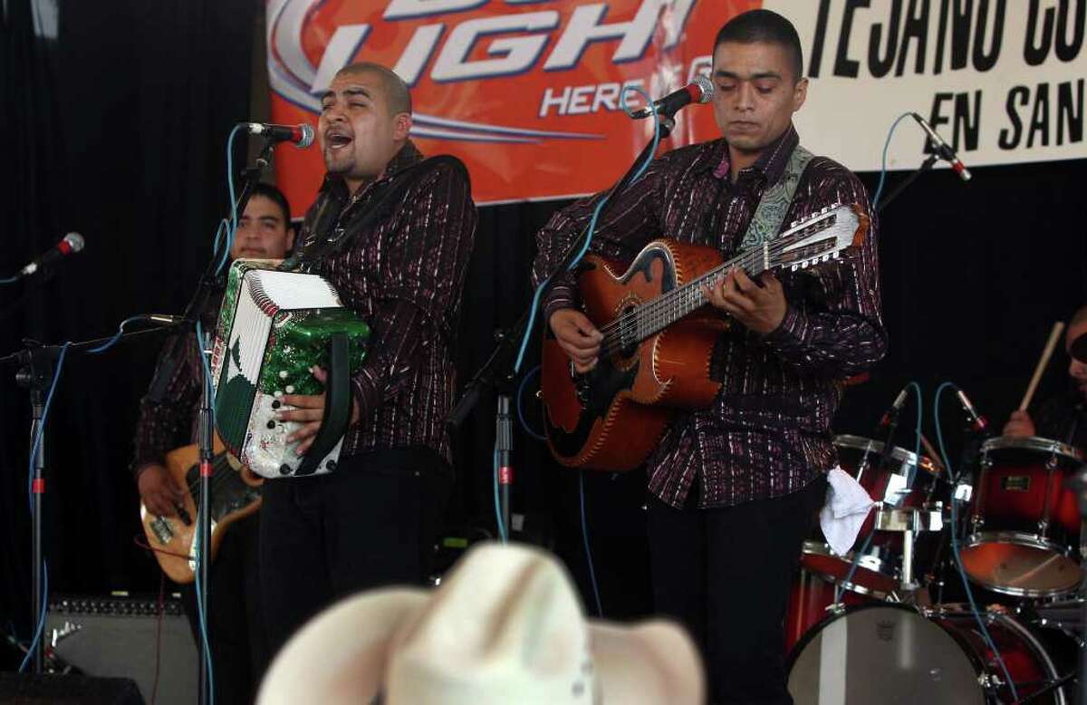 Salomon (cq) Ramos plays the accordion leading Grupo Retono Sunday May 15, 2011 at Rosedale Park during the last day of the Tejano Conjunto Festival. On the right playing the bajo sexto is Samuel Ramos. The festival started last Thursday. JOHN DAVENPORT/jdavenport@express-news.net