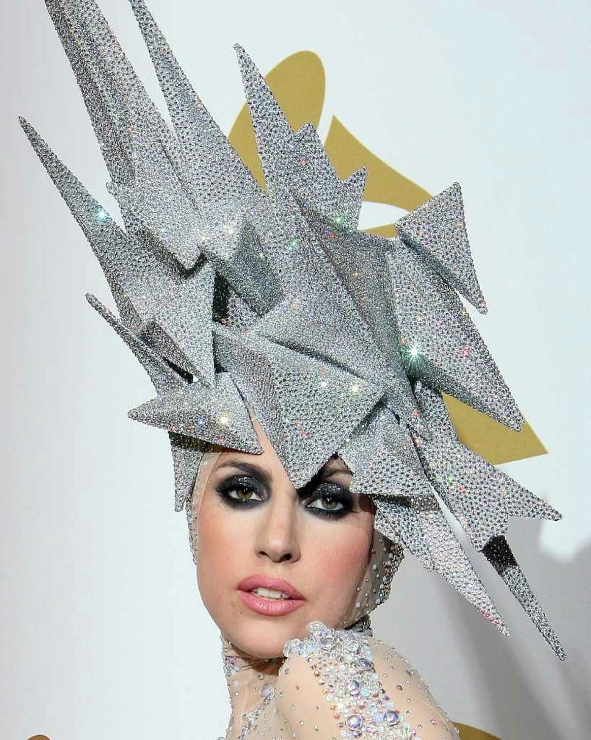 Lady Gaga poses with her awards during the 52nd annual Grammy Awards in Los Angeles, California on January 31, 2010.