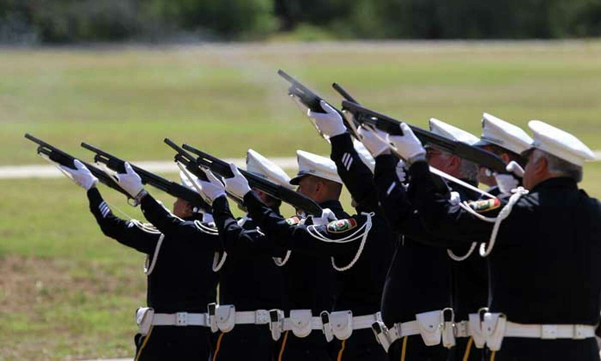 A 21-gun salute is fired at the Police Training Academy Tuesday May 17, 2011 during a tribute for fallen San Antonio Police Officers. JOHN DAVENPORT/jdavenport@express-news.net