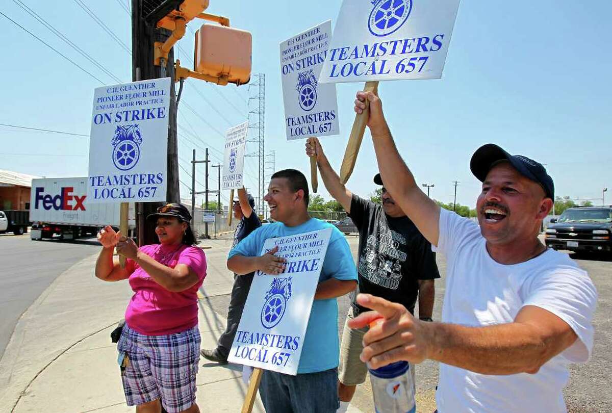 In this file photo, striking workers Loretta Ramirez (from left), Patrick Diaz, Patrick Cantu, Encarnacion Rodriguez and Simon Cantu demonstrate outside C.H. Guenther and Son Inc.