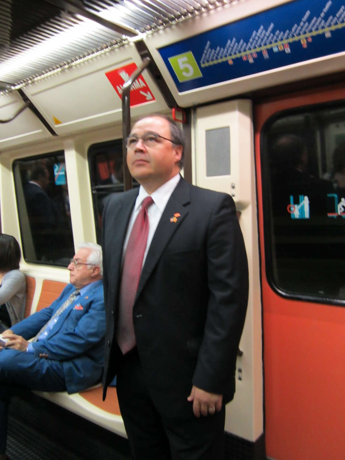 San Antonio Hispanic Chamber of Commerce President and CEO Ramiro Cavazos rides the Madrid subway on Tuesday.