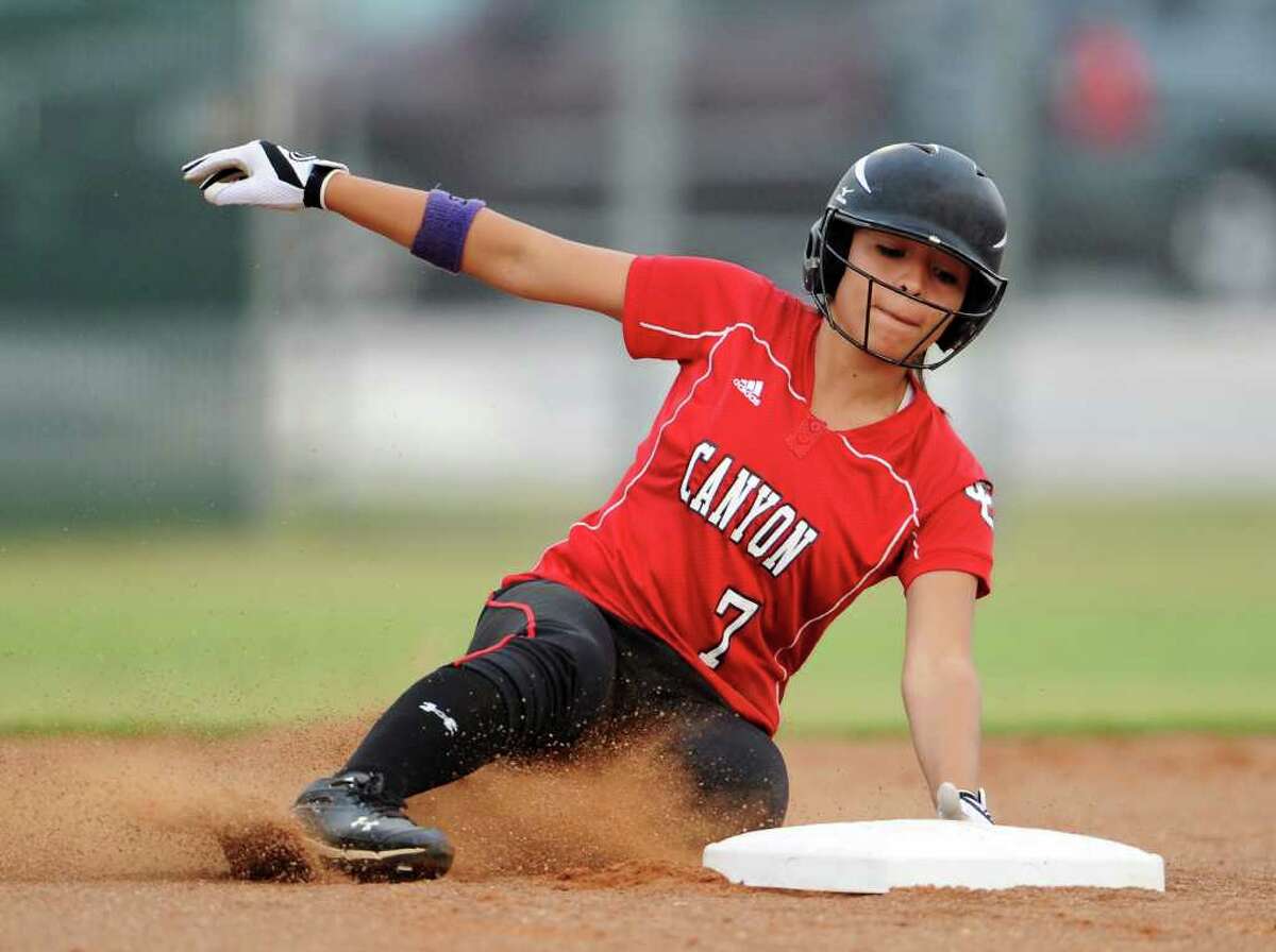 New Braunfels Canyon's Bianca Prado slides safely into second base during the Class 4A fourth-round softball playoff game between the New Braunfels Canyon Cougars and the Corpus Christi Tuloso-Midway Cherokee at the Pleasanton ISD Sports Complex in Pleasanton, Texas on May 19, 2011 John Albright / Special to the Express-News.