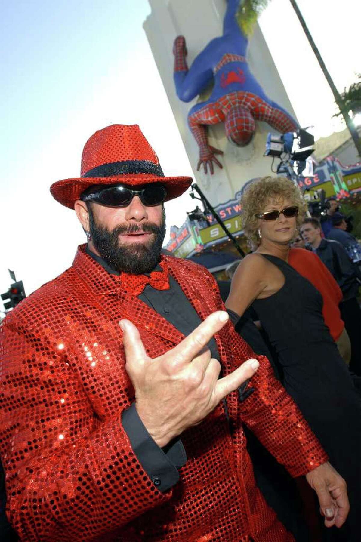 LOS ANGELES, CA - FILE: Pro wrestler Randy "Macho Man" Savage arrives at the premiere of the film "Spider-Man" April 29, 2002 in Los Angeles, California. According to reports on May 20, 2011, Savage, real name Randy Poffo, died in a car accident this morning in Tampa, Florida.