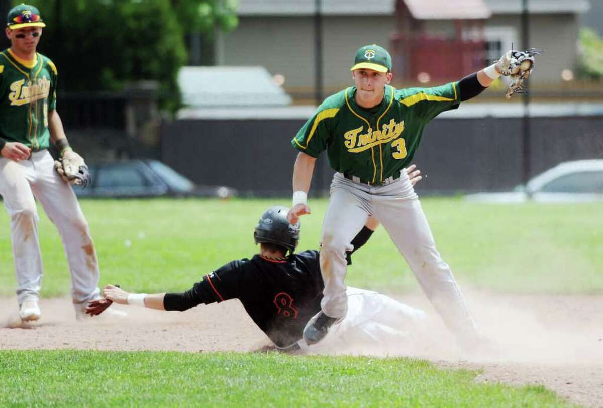 Trinity Catholic's Mike Palomba makes the catch at second as Stamford High's Phil D'Amico is out in baseball action in Stamford, Conn. on Saturday May 21, 2011.