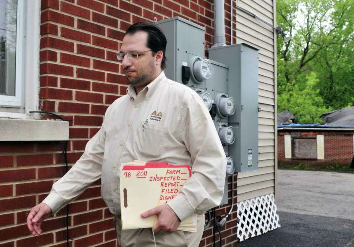 Real estate appraiser David Fontana arrives for an inspection at a multi-unit dwelling in Schenectady Friday morning May 20, 2011. (John Carl D'Annibale / Times Union)