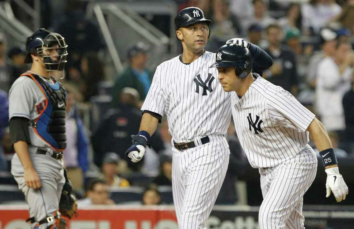 New York Yankees Derek Jeter smiles along side of New York Mets