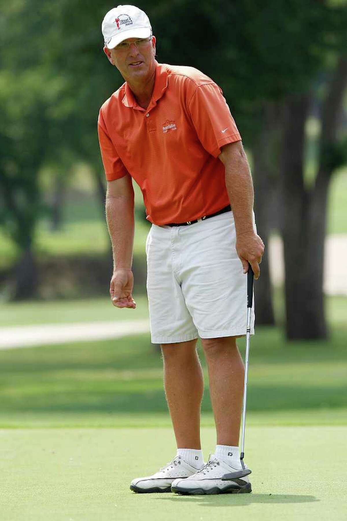 John Pierce watches his putt on the tenth green during the final round of the Greater San Antonio Men's Mid-Amateur Championship at Pecan Valley Golf Course, Sunday, May 22, 2011. JERRY LARA/glara@express-news.net