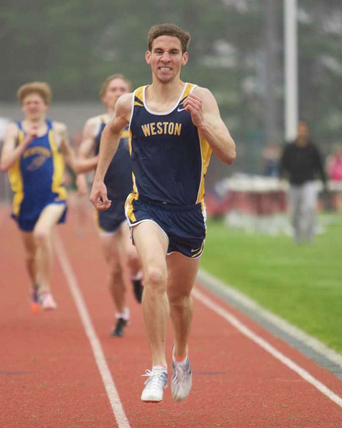 Weston's Stephen Vento wins the 1600 meters at the SWC Track and Field Championships Monday at Bethel High School.