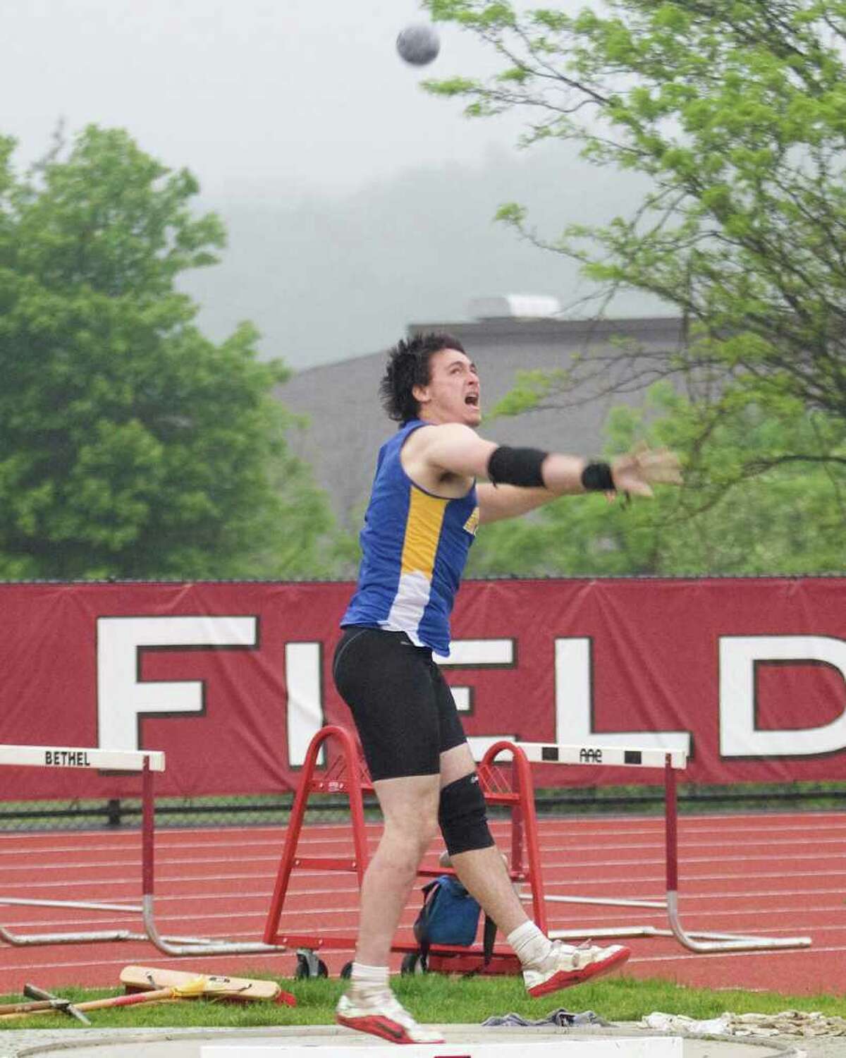 Newtown's John Wlasuk notched his third first place finish by winning the shot put at the SWC Track and Field Championships Monday at Bethel High School. Wlasuk also won the discus and javelin.
